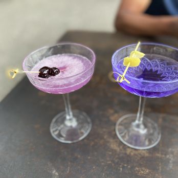 The Water Stop - two purple cocktails on a table - American Near Me - Marfa, Texas The Water Stop - two purple cocktails on a table - American Near Me - Marfa, Texas