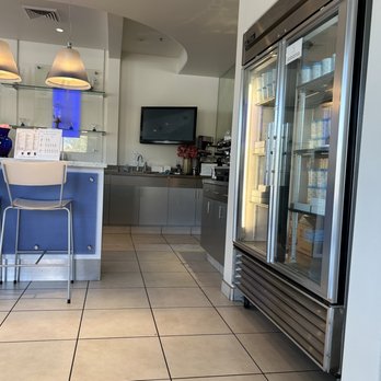 Frost Gelato - a kitchen with a refrigerator and a bar - Gelato Near Me - Tucson, Arizona Frost Gelato - a kitchen with a refrigerator and a bar - Gelato Near Me - Tucson, Arizona
