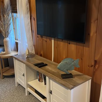 Kimberly's Home Services - a flat screen tv in a living room - Home Cleaning Near Me - Hyannis, Massachusetts