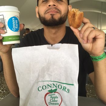Connors Farm - An apple cider donut and apple cider. - Farmers Market Near Me - Danvers, Massachusetts