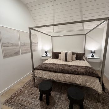 Starlight Home Services - Hung up wall art, installed bedside tables, area rug placed under bed. - Holiday Decorating Services Near Me Starlight Home Services - Hung up wall art, installed bedside tables, area rug placed under bed. - Holiday Decorating Services Near Me