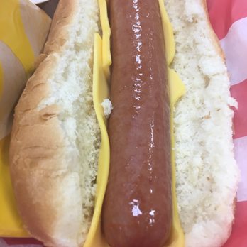 Cottons Kitchen - a hot dog with mustard and ketchup - Food Trucks Near Me