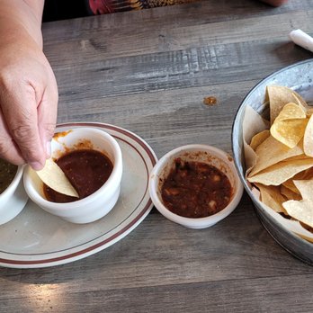 Jose Tequila's - In house chips & dips. The one on the table is the  best,  fresh cilantro chilies  & tomatoes blends well - Mexican Near Me - Virginia Beach, Virginia