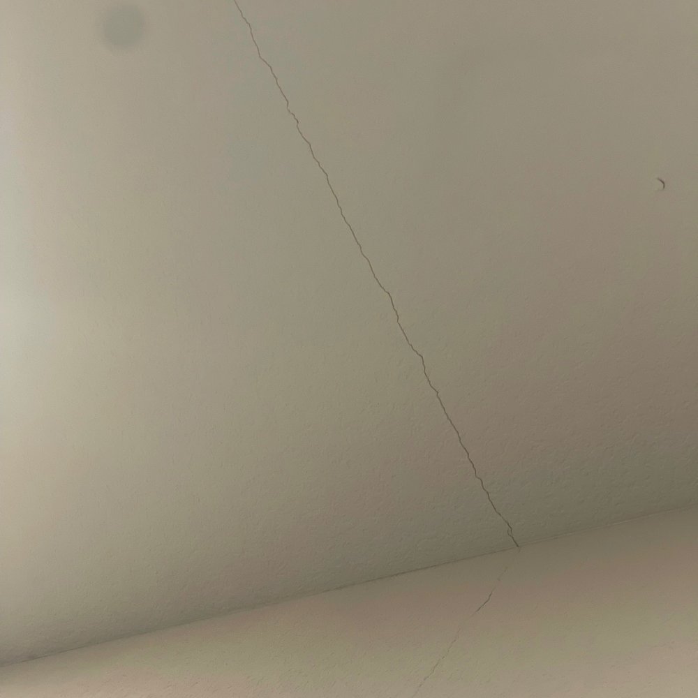 This is the crack that they told us is fine and we can contact the contractors board to get fixed.. YET WE ARE UNDER WARRANTY This is the crack that they told us is fine and we can contact the contractors board to get fixed.. YET WE ARE UNDER WARRANTY