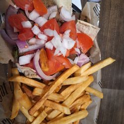 Charlies Restaurant & Taverna - Well done fries. Gyro with extra tomato and onion. Extra sauce on the side.