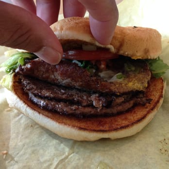 Storms Drive-In Restaurant - Actually, there's a hint of mustard on the top patty; could hardly taste it. Teeny burger! - Burgers Near Me - Burnet, Texas Storms Drive-In Restaurant - Actually, there's a hint of mustard on the top patty; could hardly taste it. Teeny burger! - Burgers Near Me - Burnet, Texas