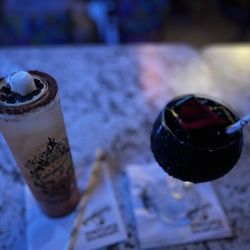 Kalaveras - LA VELA serrano infused tequila, mango, pineapple cucumber, lime juice. PALOMA NEGRA blanco tequila, lime juice, charcoal infused tequila