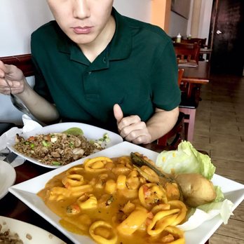 Sabor a Perú - Macho fish filet in the yummiest sauce ever with mussels, shrimp, and squid. It's not curry. Huge portion too 5/5 - Peruvian Near Me - Miami, Florida