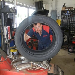 Belgium Service Center - Belgium Service Center owner, Dave Kaan replacing 22" tires for a customer.