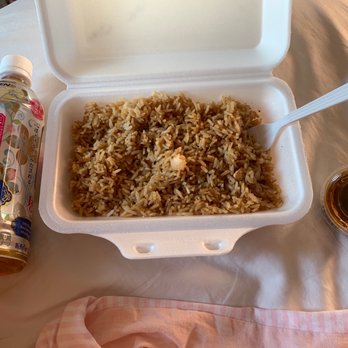 Hibachi Xpress - a container of rice with a spoon and a container of sauce - Japanese Near Me - Fairlawn, Ohio Hibachi Xpress - a container of rice with a spoon and a container of sauce - Japanese Near Me - Fairlawn, Ohio
