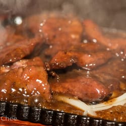 TANG Chinese Cuisine - Fried Beef Tenderloin with Black Pepper Sauce (#B06). $13.99. Served with onions on a sizzling plate. Slightly spicy.