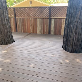 The Fence Man - Portion of back deck and back fence. There is a third redwood tree to the left of the two pictured above. - Fences & Gates Near Me - Los Gatos, California The Fence Man - Portion of back deck and back fence. There is a third redwood tree to the left of the two pictured above. - Fences & Gates Near Me - Los Gatos, California