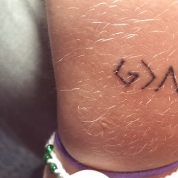 Orange Beach Tattoo - That greater than symbol is totally not proportionate. Not a show off piece for sure. - Tattoo Near Me - Orange Beach, Alabama