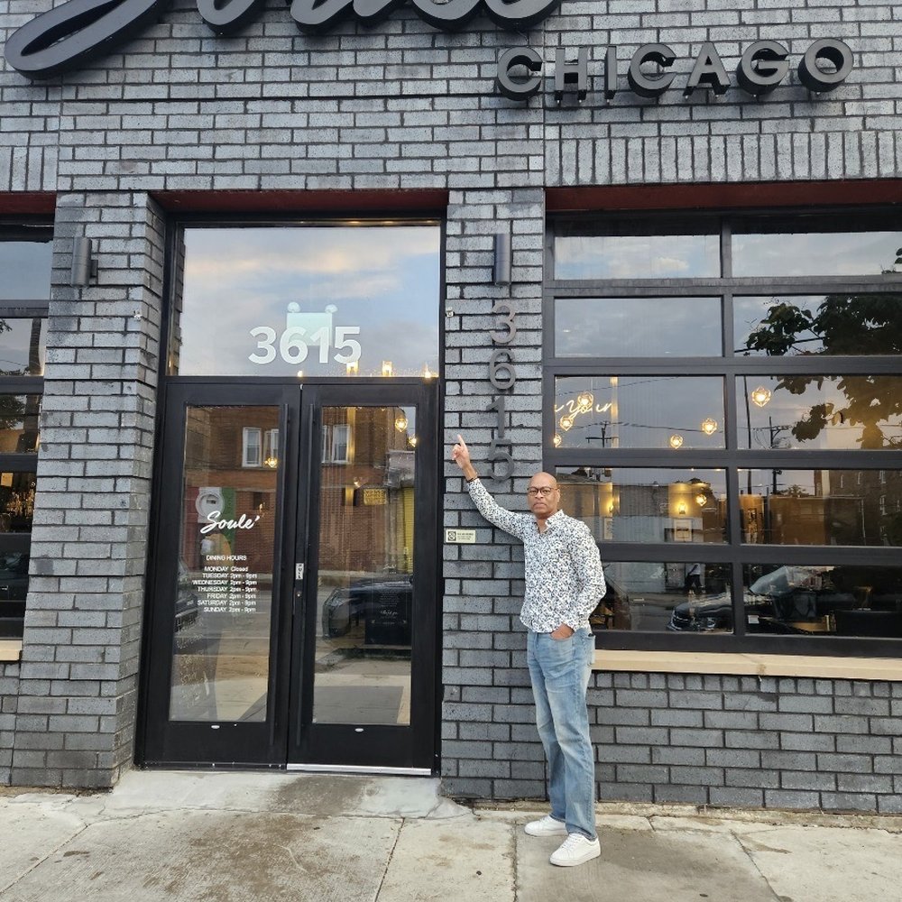 Soulé - a man standing in front of a store - Soul Food Near Me - Chicago, Illinois Soulé - a man standing in front of a store - Soul Food Near Me - Chicago, Illinois