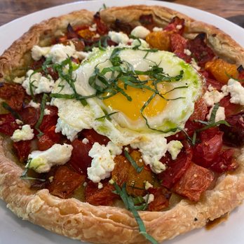 A'Bouzy - Heirloom tomato galette and egg - Champagne Bars Near Me - Houston, Texas A'Bouzy - Heirloom tomato galette and egg - Champagne Bars Near Me - Houston, Texas