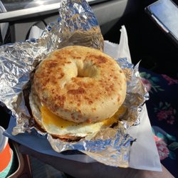BIGGBY COFFEE - Sausage egg and cheese on an Asiago bagel