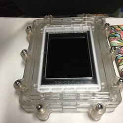 Home Tech Repair - Clamping new Digitizer on a iPad to assure proper sealing.