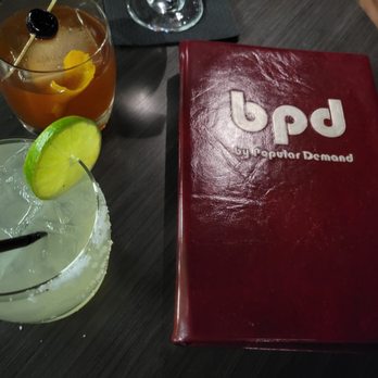 By Popular Demand - two cocktails on a table - Whiskey Bars Near Me - Houston, Texas By Popular Demand - two cocktails on a table - Whiskey Bars Near Me - Houston, Texas