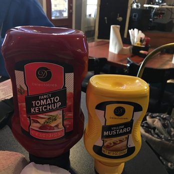 67 Grill - a ketchup and mustard on a table - Burgers Near Me - Arkadelphia, Arkansas