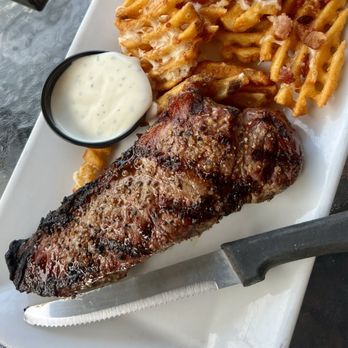 River House - NY strip with loaded waffle fries. - American Near Me - Alexandria Bay, New York River House - NY strip with loaded waffle fries. - American Near Me - Alexandria Bay, New York