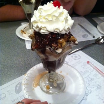 Charcoal Pit - hot fudge nut sundae with salted pretzel caramel chocolate ice cream. (hot fudge nut sundae in the back with chocolate) - Burgers Near Me - Wilmington, Delaware