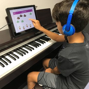 12 Note Piano Studio - This student is reviewing his Enharmonics through one of our many iPad music games! - Musical Instruments & Teachers Near Me - Phoenix, Arizona 12 Note Piano Studio - This student is reviewing his Enharmonics through one of our many iPad music games! - Musical Instruments & Teachers Near Me - Phoenix, Arizona