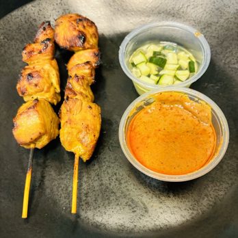 Malai Thai Street Eats - Chicken Satay with peanut sauce and diced cucumber. - Thai Near Me - Houston, Texas
