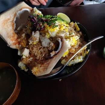 Sun and Moon - Crab fried rice served on coconut with delicious chicken soup and spicy sauce on side - Thai Near Me - San Francisco, California Sun and Moon - Crab fried rice served on coconut with delicious chicken soup and spicy sauce on side - Thai Near Me - San Francisco, California