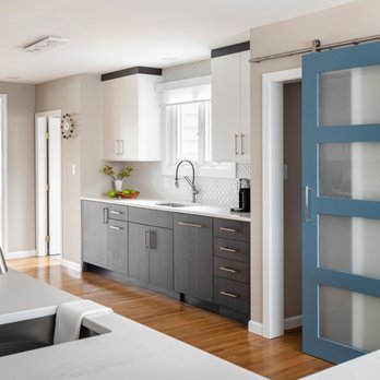 KitchenVisions - Sliding blue door to new pantry in Newton - Cabinetry Near Me