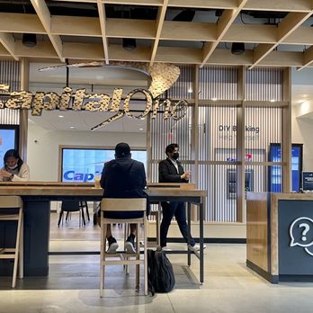 Capital One Café - two people sitting at a counter - Banks & Credit Unions Near Me - Somerville, Massachusetts Capital One Café - two people sitting at a counter - Banks & Credit Unions Near Me - Somerville, Massachusetts