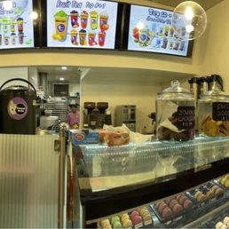 Inside the shop facing the counter