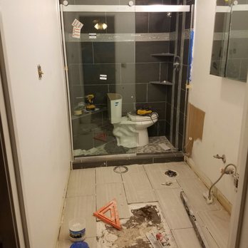 Nova Interiors - New barn door style shower door they installed and in process of doing new tile flooring. - General Contractors Near Me - Las Vegas, Nevada