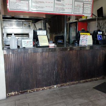 Fatte's Pizza - a man sitting at the counter - Pizza Near Me - Chula Vista, California Fatte's Pizza - a man sitting at the counter - Pizza Near Me - Chula Vista, California