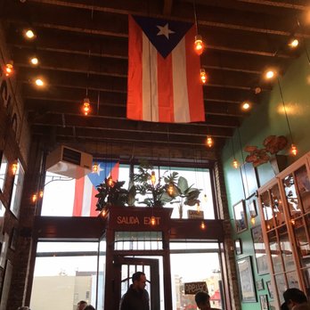 Parada 22 - Puerto Rican flag hanging in the dining area - Latin American Near Me - San Francisco, California