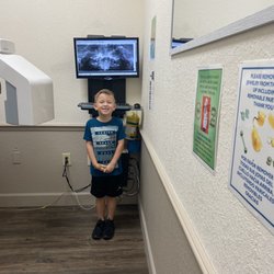 Greenberg Dental & Orthodontics - Taking a picture with his teeth!