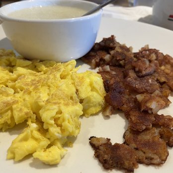 Eggsquisite Cafe - Rockwall - Eggs and corn beef hash, the way I like it. These grits are pretty great too. - Breakfast & Brunch Near Me - Rockwall, Texas