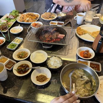 New Seoul Korean Charcoal BBQ - Mandu soup, side dishes, bowls of rice, bbq meat platter, Korean pancake (super delicious) - Korean Near Me - Des Plaines, Illinois