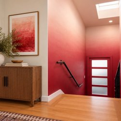 Surfside Murals - Custom crimson red ombre gradient wall mural in a modern residential stairwell, Architectural color design by Surfside Walls in Los Angeles.