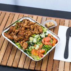 Goubaa Grub - Mediterranean Grilled Chicken  on a bed of salad
