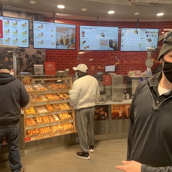 Tim Hortons - Rochester - a man wearing a face mask in a donut shop - Donuts Near Me - Rochester, New York Tim Hortons - Rochester - a man wearing a face mask in a donut shop - Donuts Near Me - Rochester, New York