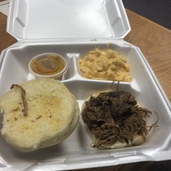 Papa Joe’s Hometown BBQ - Beef brisket sandwich meal with side of Mac and Cheese and Carolina Gold BBQ sauce
