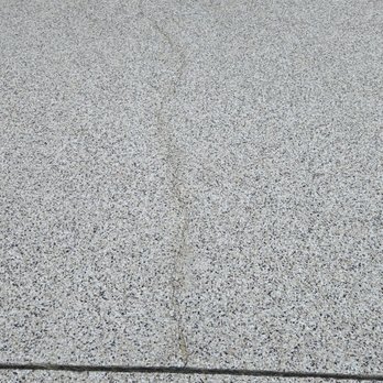 Shark Coatings - The existing concrete driveway crack reoccurred only one month after Shark Skin Coating crack repair and new surface coating. - Flooring Near Me - Jacksonville, Florida Shark Coatings - The existing concrete driveway crack reoccurred only one month after Shark Skin Coating crack repair and new surface coating. - Flooring Near Me - Jacksonville, Florida