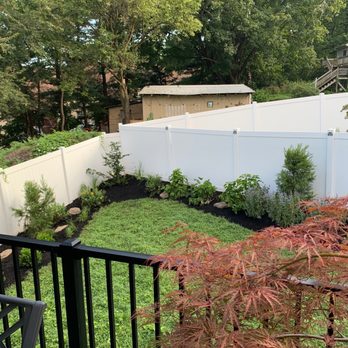 EcoLandscapes Design - a backyard with a fence and a garden - Landscaping Near Me - Conshohocken, Pennsylvania