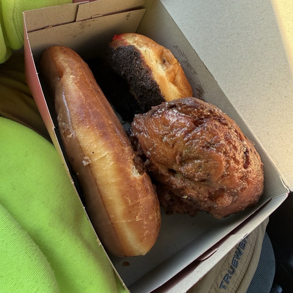 Maple bar, doughnut, Oreo doughnut, and an apple fritter