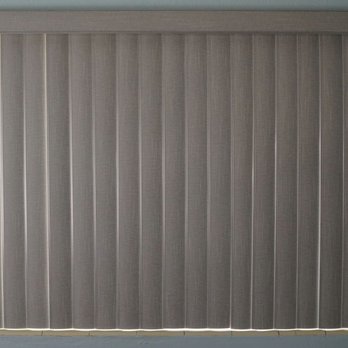 All About Blinds - All About Blinds and Shutters. Jacksonville, FL. Vertical blinds, gray fabric panel. - Shades & Blinds Near Me - Jacksonville, Florida All About Blinds - All About Blinds and Shutters. Jacksonville, FL. Vertical blinds, gray fabric panel. - Shades & Blinds Near Me - Jacksonville, Florida