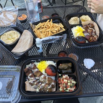 Lemon Zest Cafe - Foreground: vegan kebab lunch plate. Background, right: lamb dish, Middle French fries, left hummus and pita. - Mediterranean Near Me - Glendale, California Lemon Zest Cafe - Foreground: vegan kebab lunch plate. Background, right: lamb dish, Middle French fries, left hummus and pita. - Mediterranean Near Me - Glendale, California