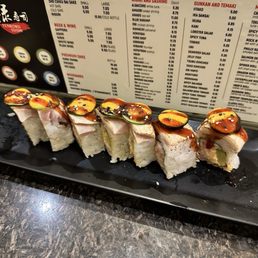 California roll on the inside and seared white tuna + thin sliced jalapeño. Mexican Roll (9) California roll on the inside and seared white tuna + thin sliced jalapeño. Mexican Roll (9)