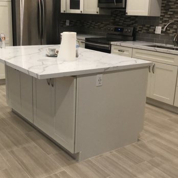 Eagle Construction & Engineering - a kitchen with white cabinets and stainless steel appliances - General Contractors Near Me Eagle Construction & Engineering - a kitchen with white cabinets and stainless steel appliances - General Contractors Near Me