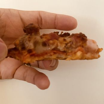 Nancy's Pizza Raleigh - Thin crust meat lovers... there is a full layer of pepperoni on the bottom! - Pizza Near Me - Raleigh, North Carolina