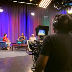 Community Media Access Collaborative - CMAC - Operating the studio camera during a show.
